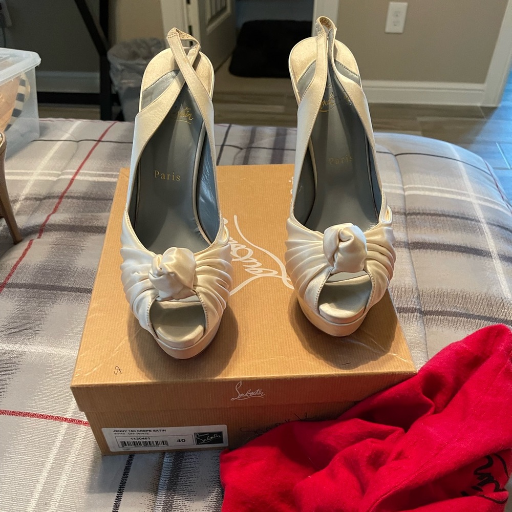Off white, satin red bottoms.  Worn twice and have been sitting in my closet.